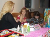 Glamour and Spa Party Toronto photo of Melanie giving two girls manicures 