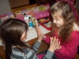 girls having fun playing together after getting their nails done during spa party fun
